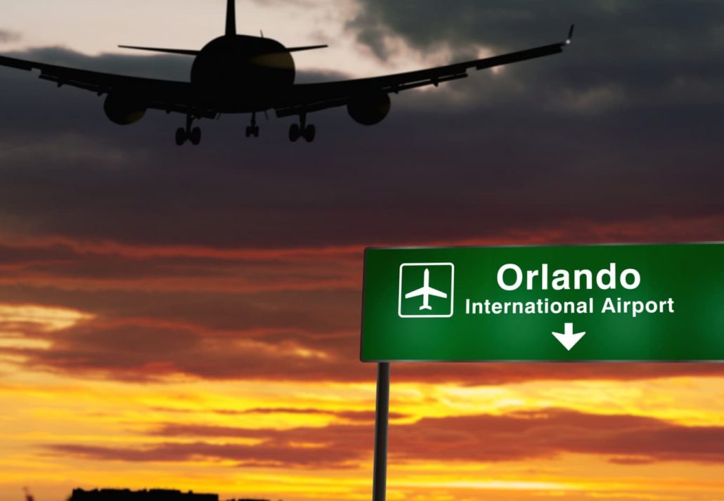 Airplane silhouette landing in Orlando, Florida, USA. 