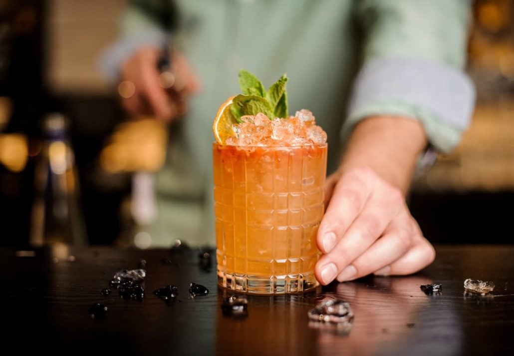 Bartender making a cocktail.