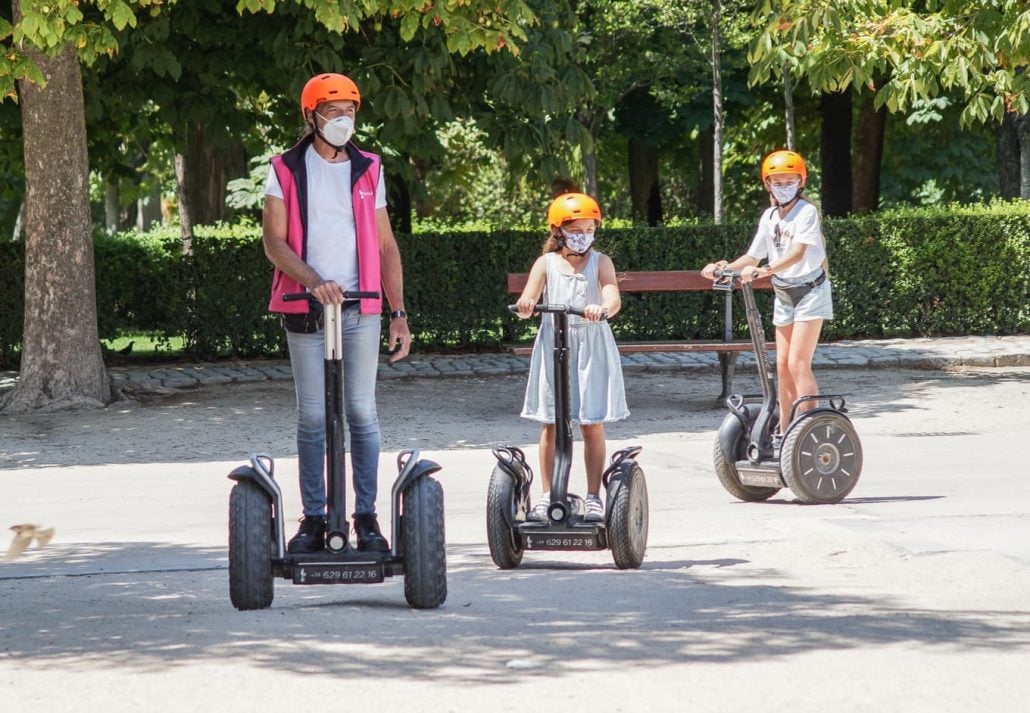 Two children on a guided segway tour in Madrid, Spain.