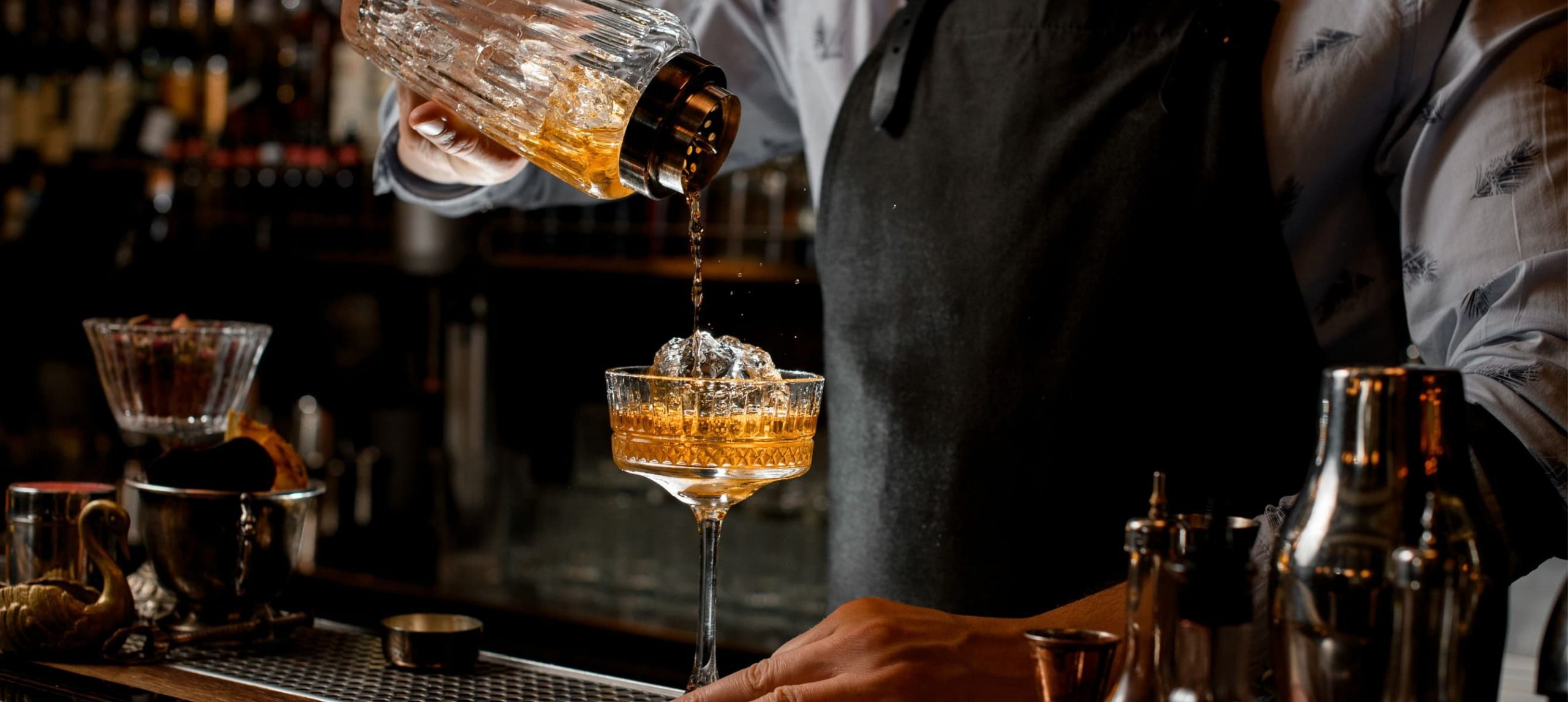 A bartender creating a drink