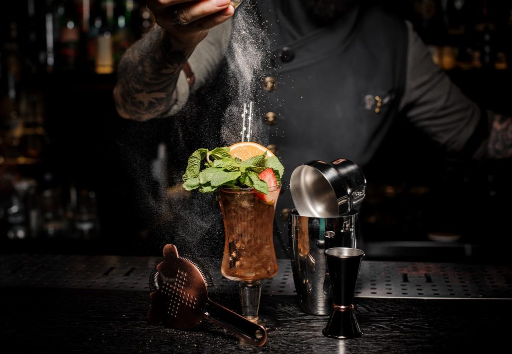Barman making a fresh cocktail