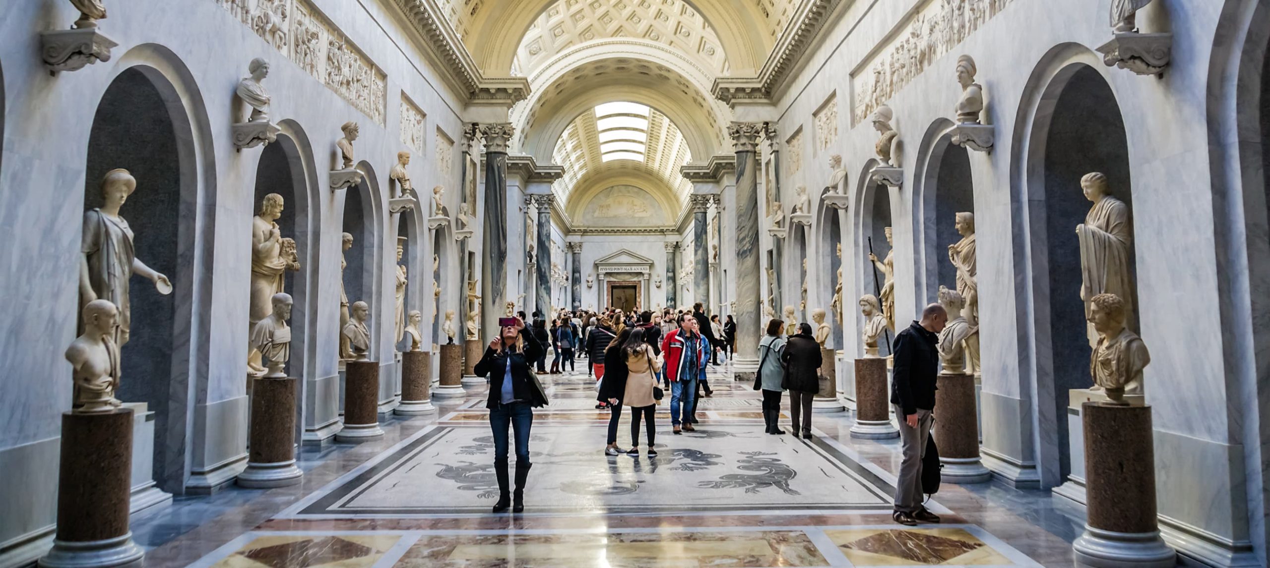 Best Museums In Rome: People visiting The Vatican Museums, in Rome, Italy.