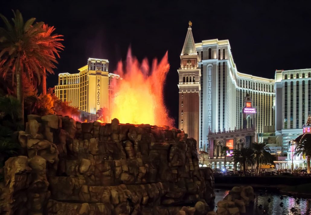 The Mirage Hotel Volcano bursting with lava at nighttime.