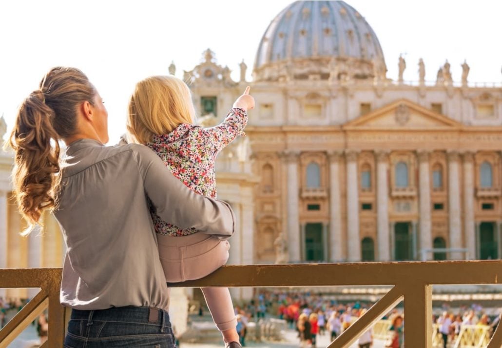 A little girl with her mom at the Vatican, in Rome, Italy
