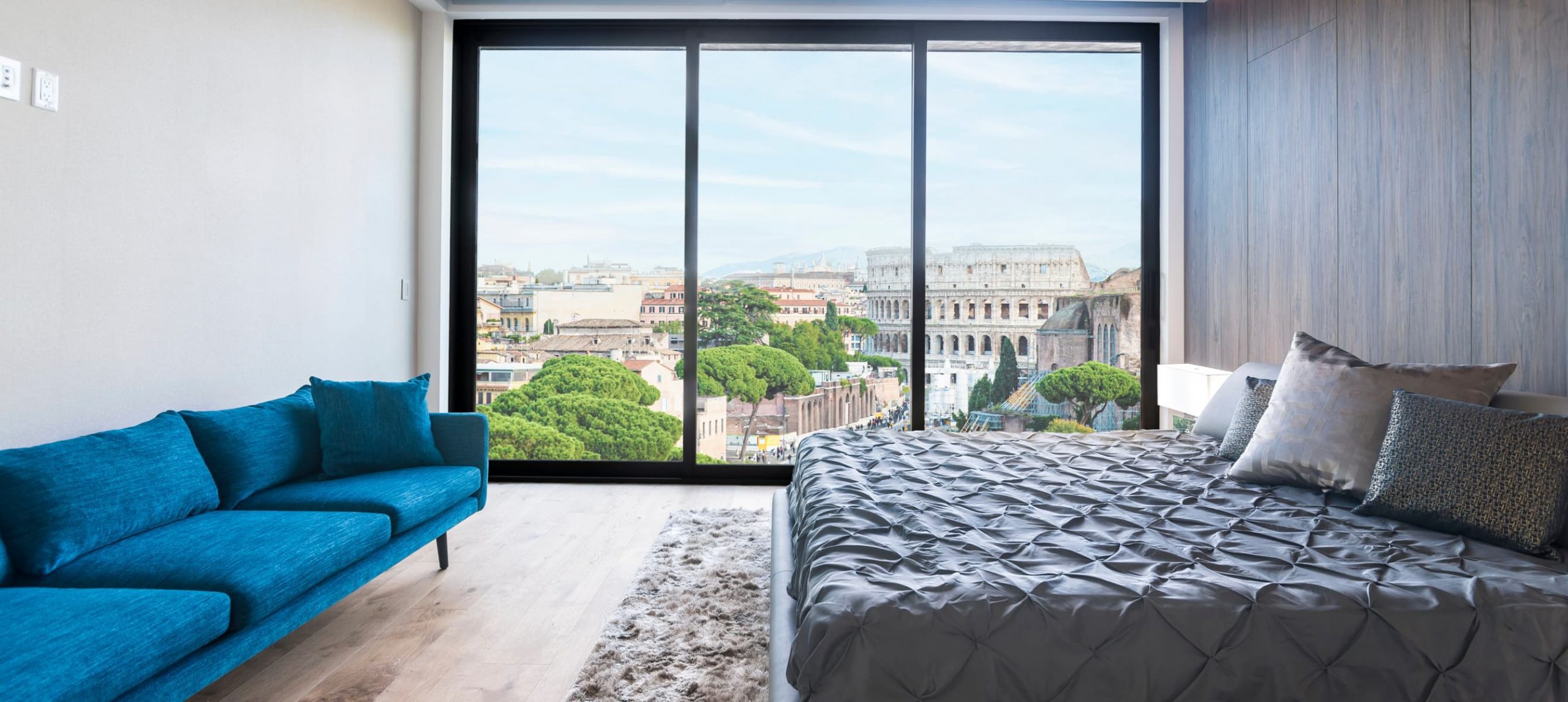 Modern and contemporary bedroom in Rome with views of the The Colosseum.