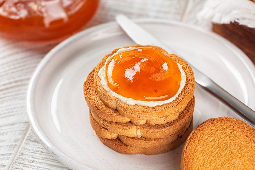 A pile of Fette Biscottate with jam