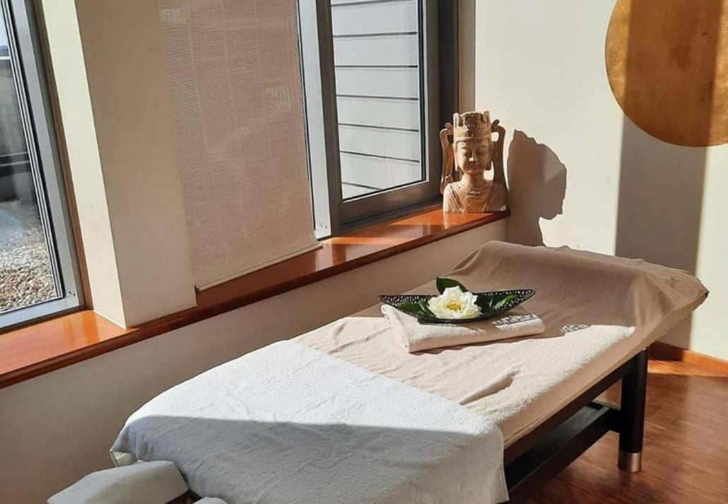 A massage table next to the windows in Meridian spa, Berlin