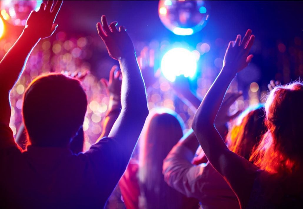 Young crowd partying at a nighclub.