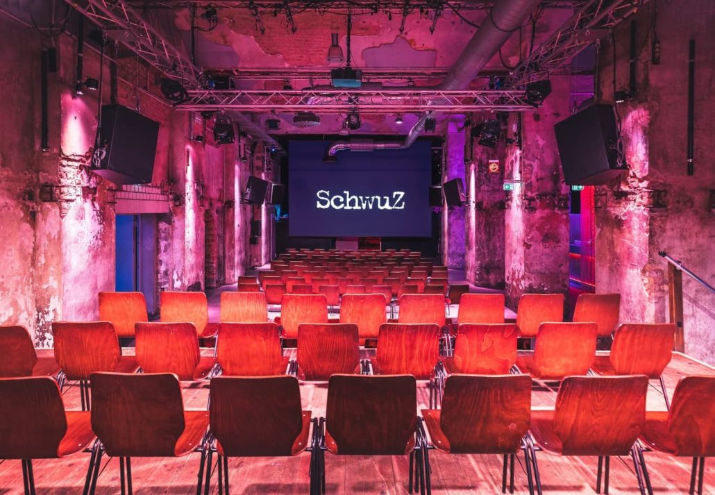 berlin-gay-party-scene-schwuz | CuddlyNest Travel Blog A speaking venue with chairs in front at Schwuz Berlin