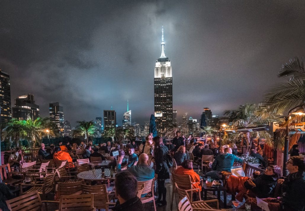 People having drinks at a NYC rooftop bar