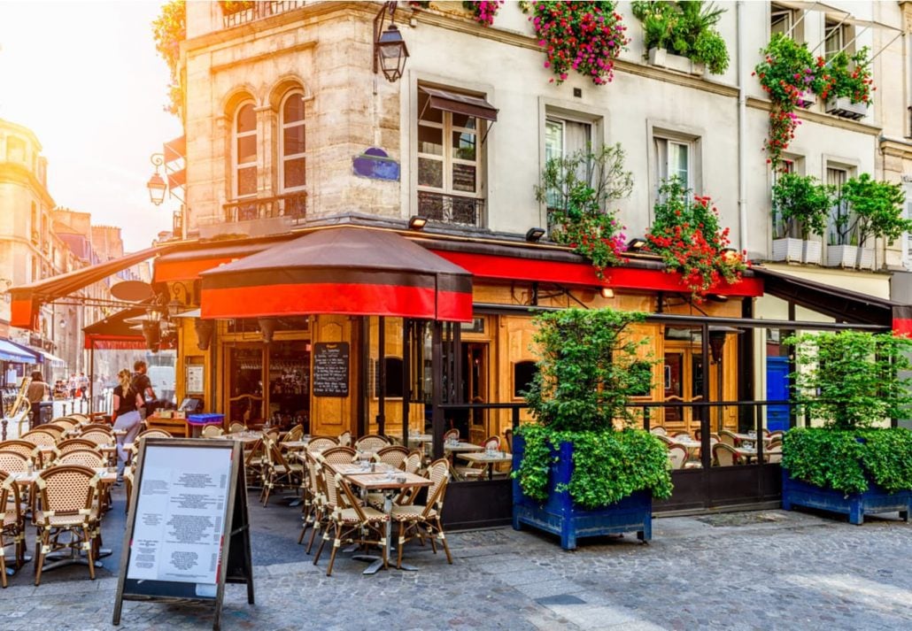 Berlin vs Paris: A charming restaurant by the sidewalk in Paris