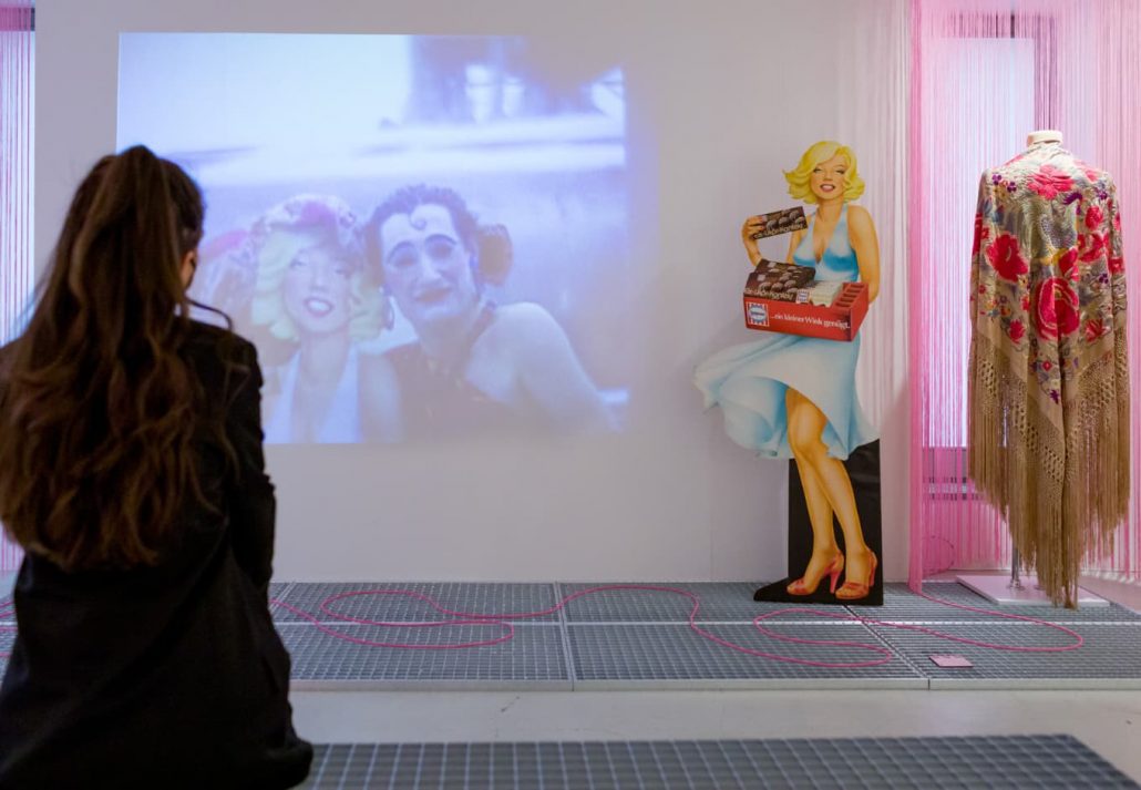 A woman looking at a video display at Schwules Museum