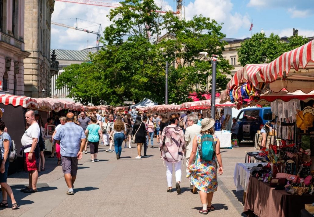 People walking and looking at the art pieces at the art market Zeughaus