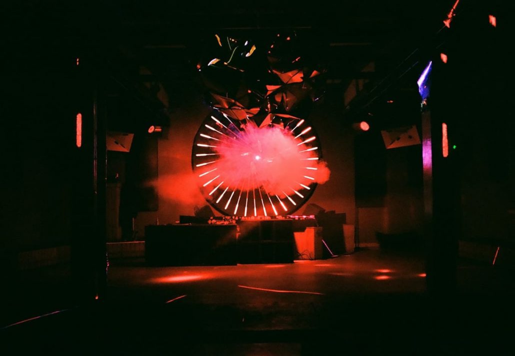 Dance floor with red lights at Anomalie Art Club