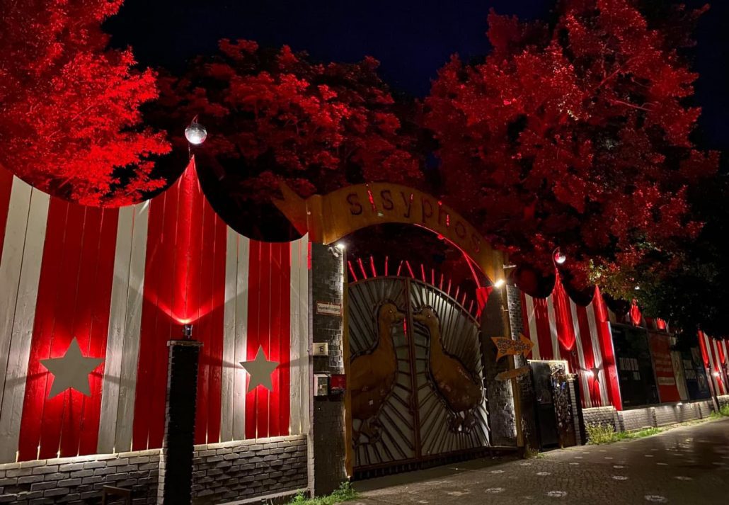 Carnival-like entrance door to Sisyphos club at nighttime