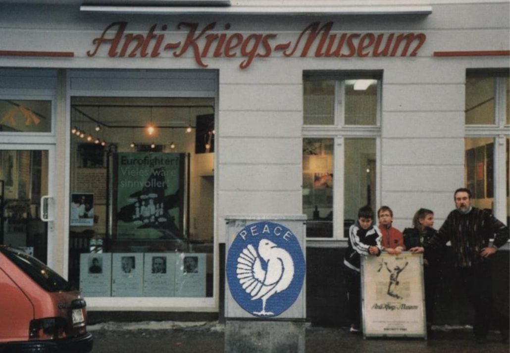 Entrance to the Anti War Museum with people standing in front looking across the street