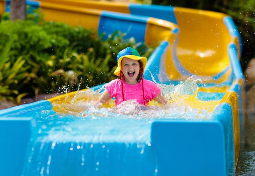 A girl going down a water slide