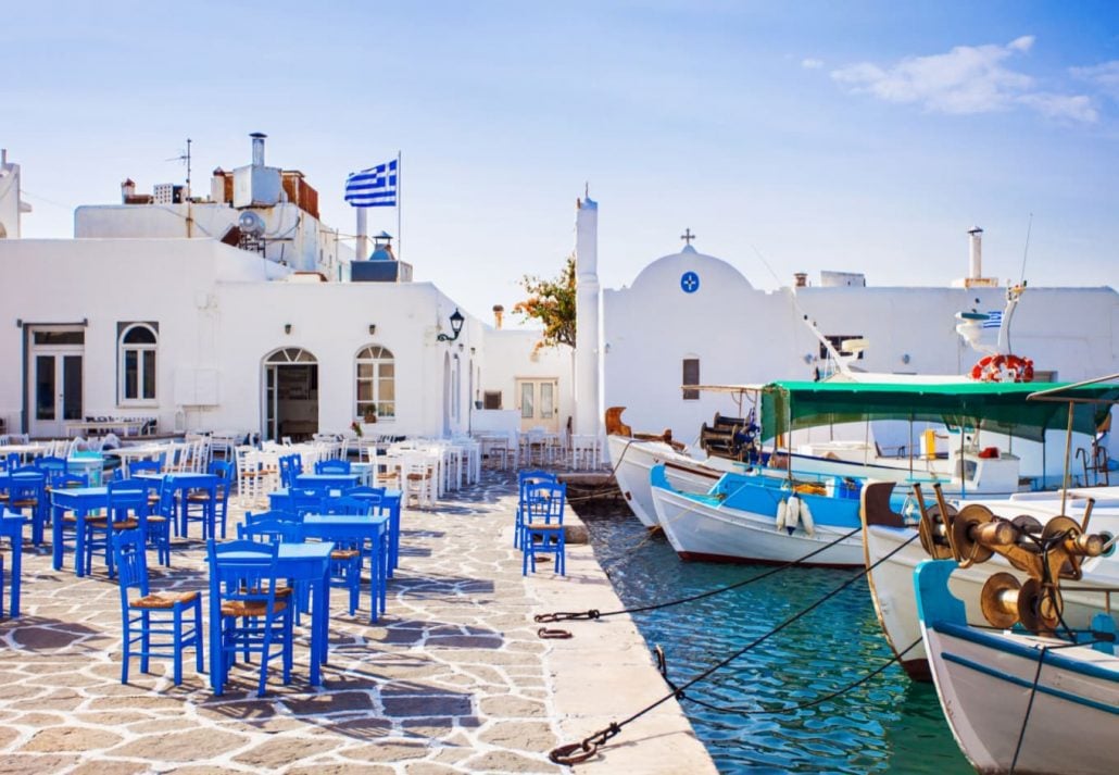 A port at one of the islands in Greece with a bar nearby