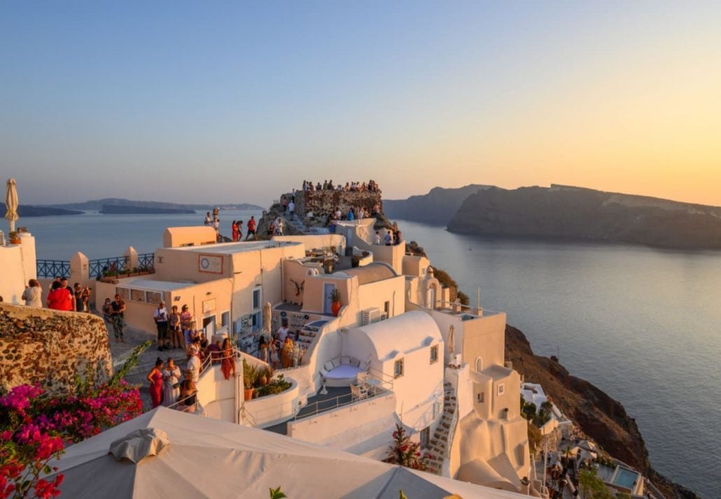 Tourists climbing Santorini