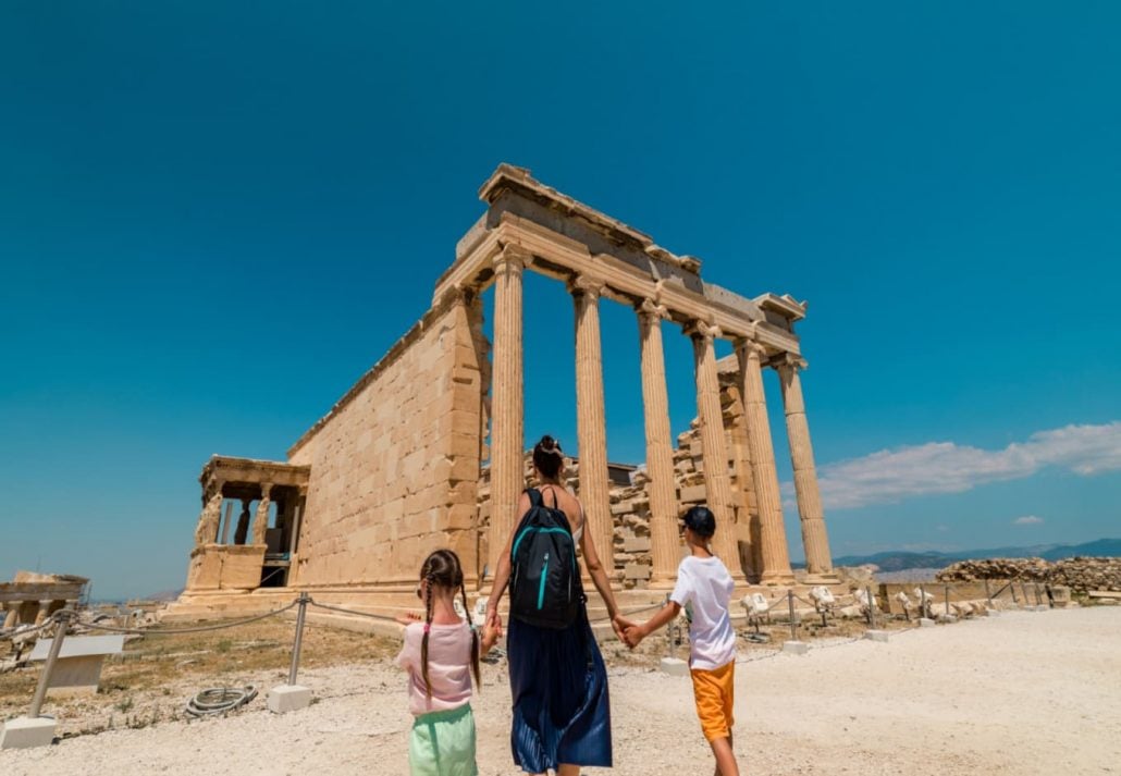 Kids with mom in front of Athens landmarks