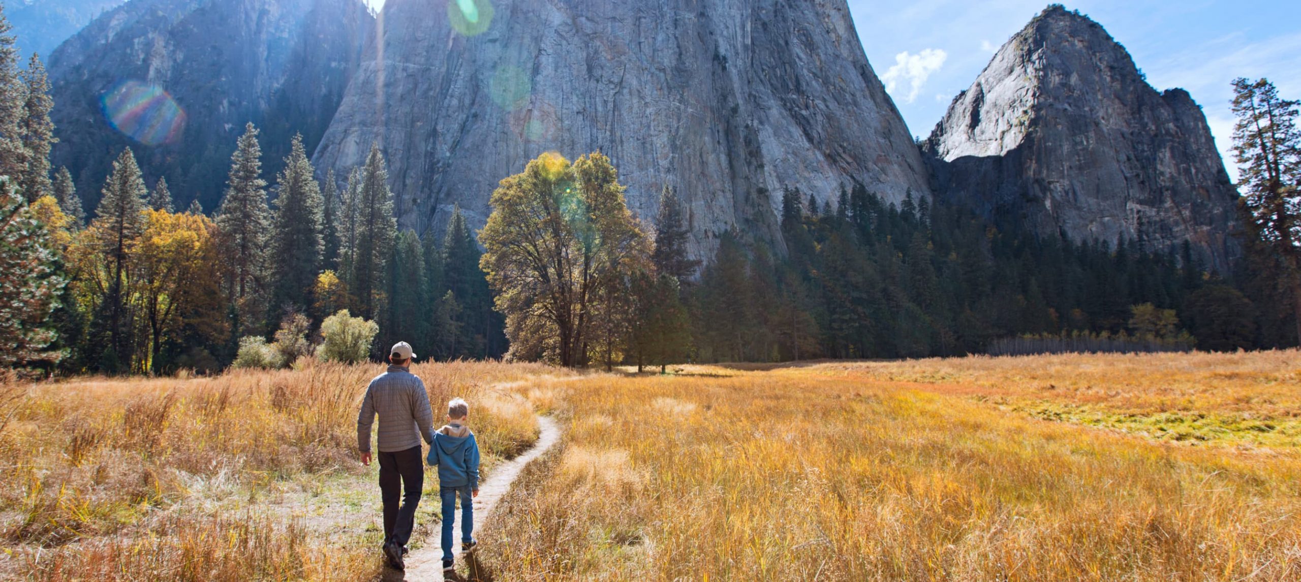 Father and son exploring the Yosemite National Park, in California.