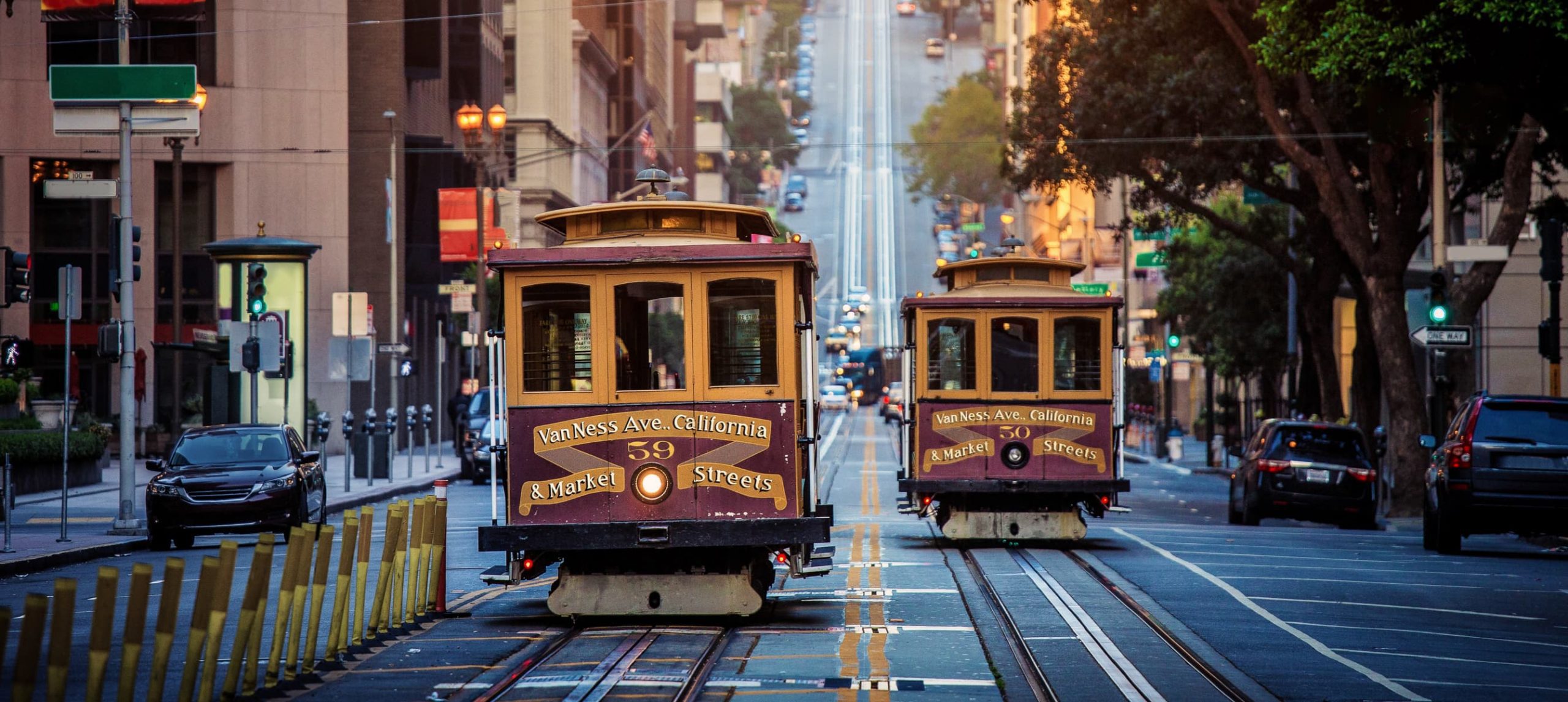 Two cable cars passing through California Street, in San Francisco, California.