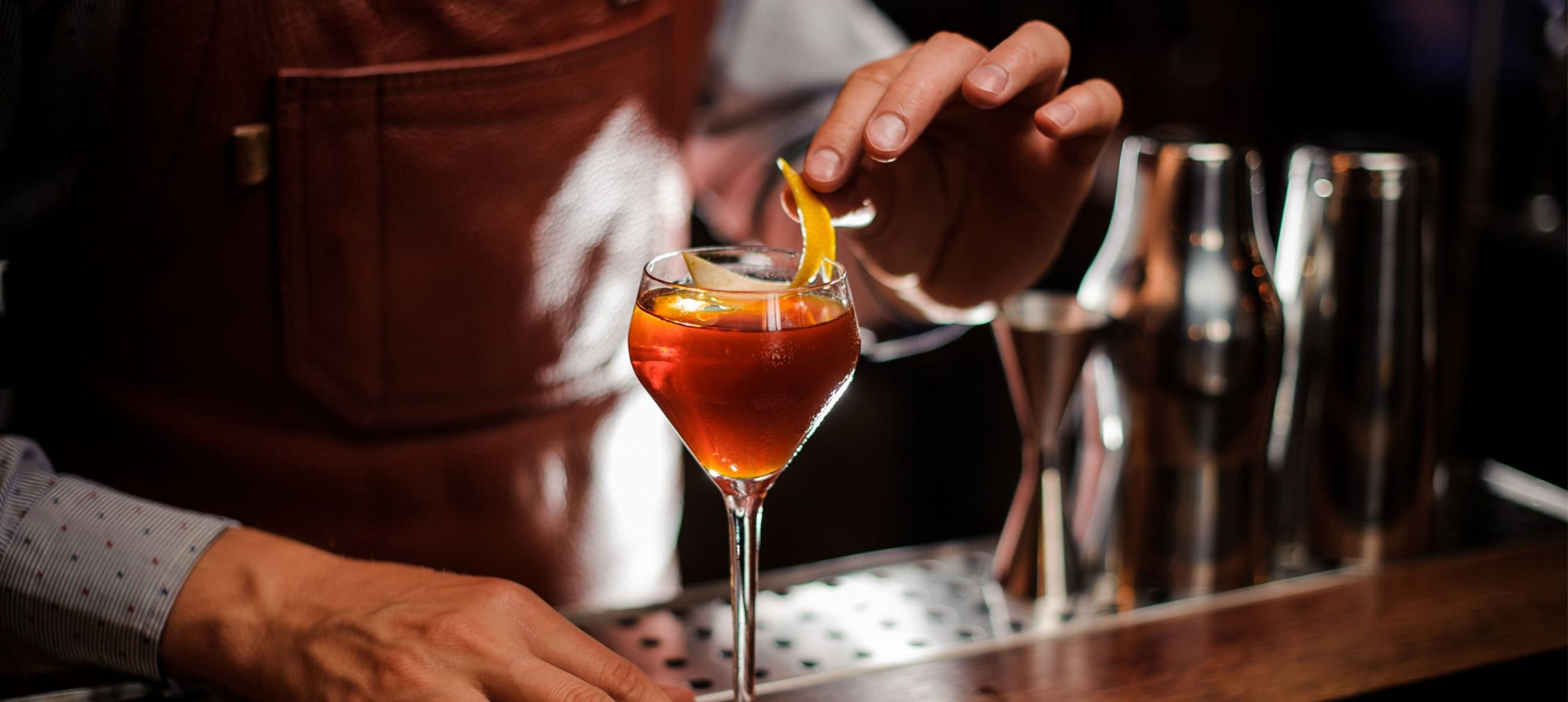 Mixologist making a fancy cocktail.