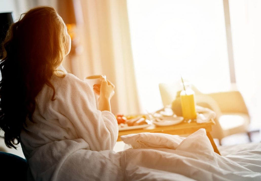 A girl having breakfast in bed