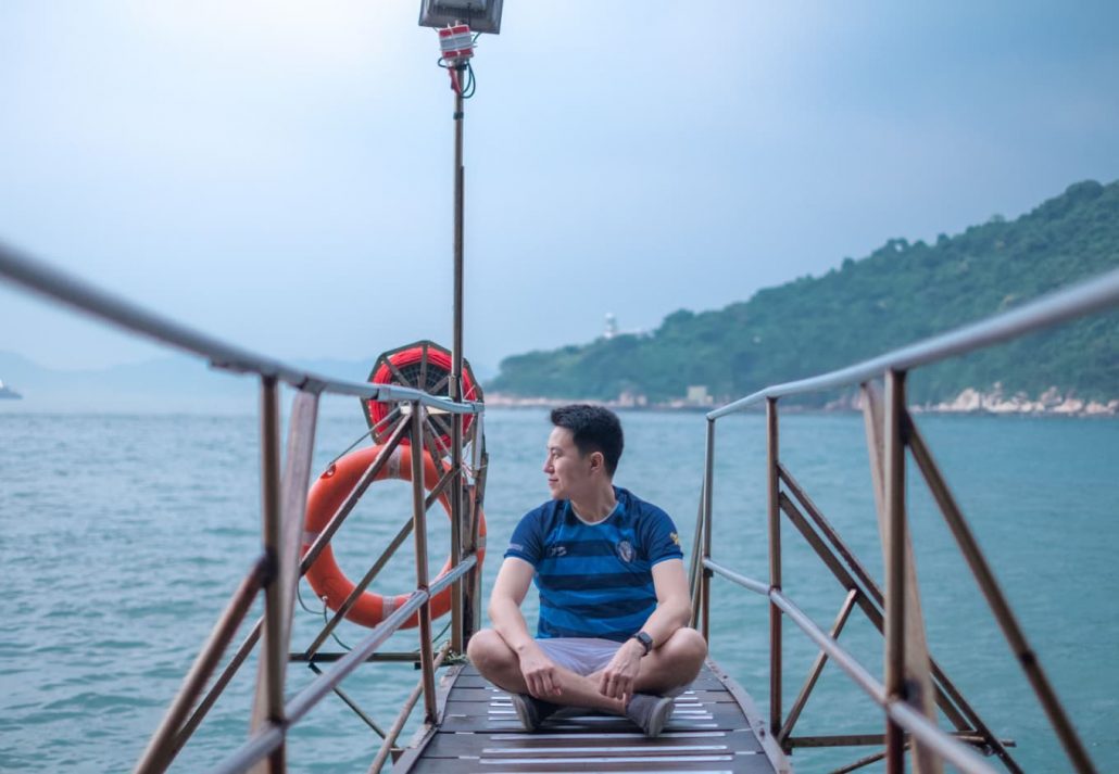 Tourist and Photographer at Sai Wan Swimming Shed located in Kennedy town with offshore step into the sea.