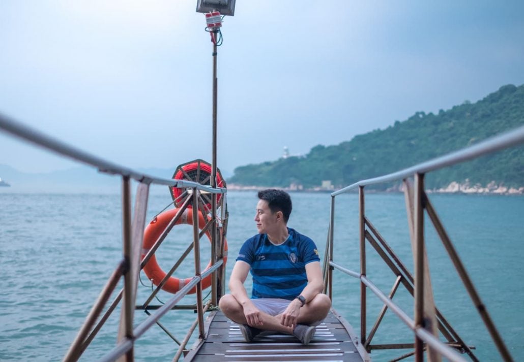 instagrammable-places-hong-kong-sai-wan-swimming-shed | CuddlyNest Travel Blog Tourist and Photographer at Sai Wan Swimming Shed located in Kennedy town with offshore step into the sea.