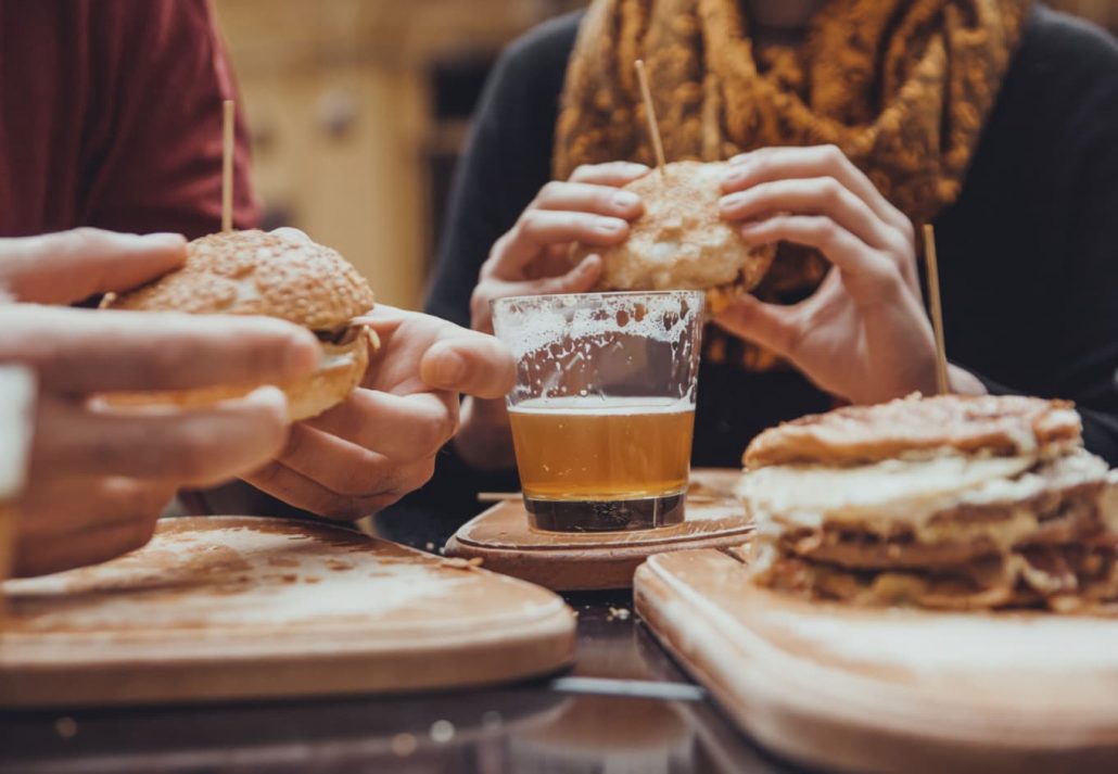 People eating burgers at a restaurant