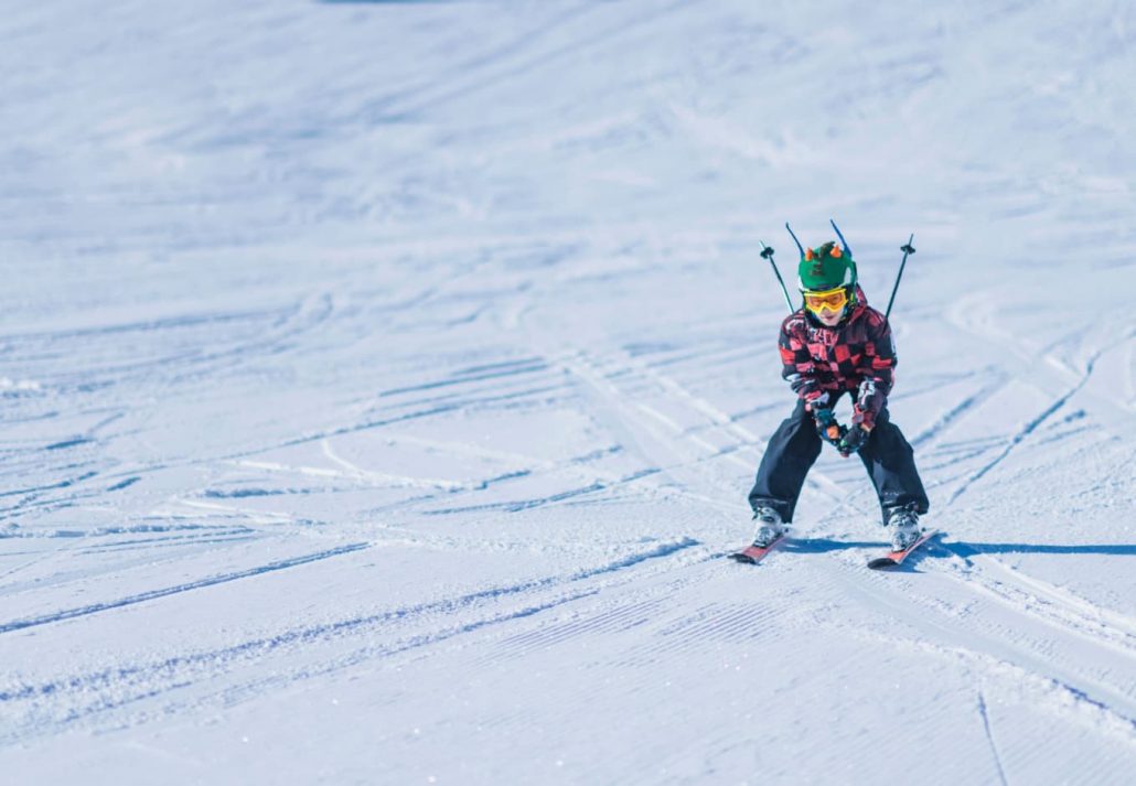 skiing-in-greece-2 | CuddlyNest Travel Blog A little boy skiing and looking at the camera