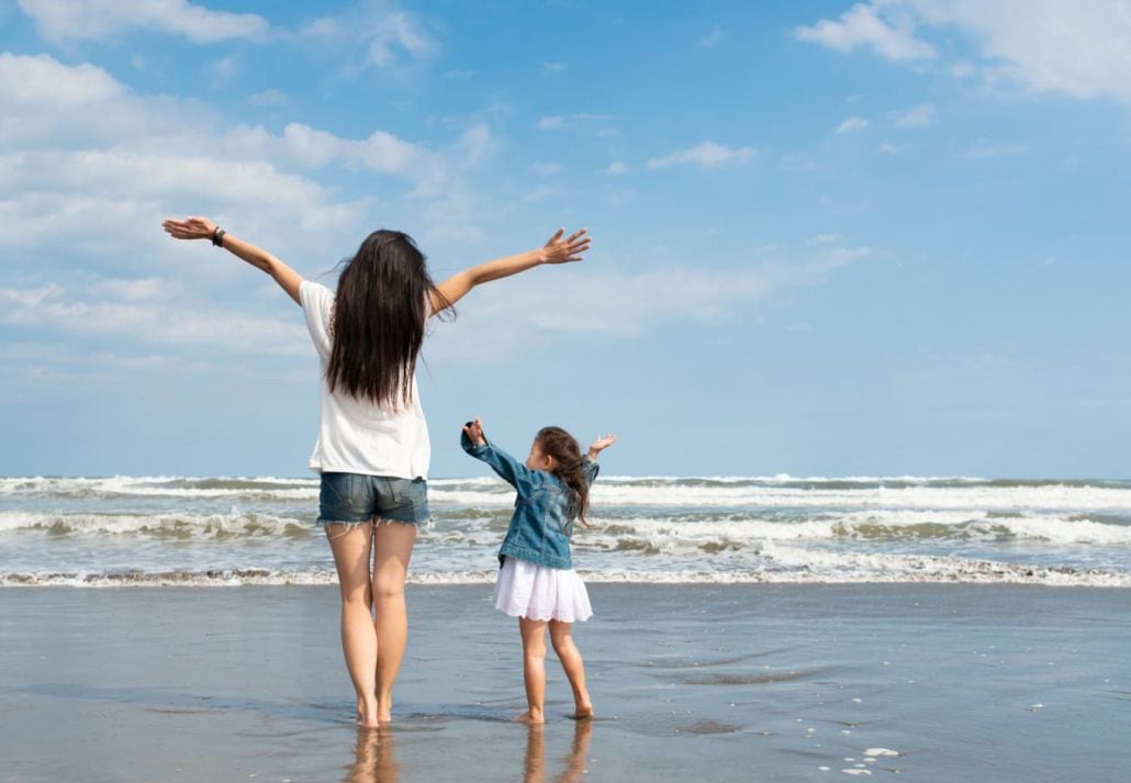 Moter and daughter at the beach in Japan