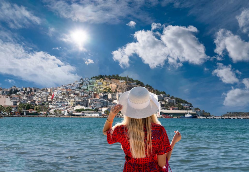 A woman standing in front of the sea in Kusadasi city