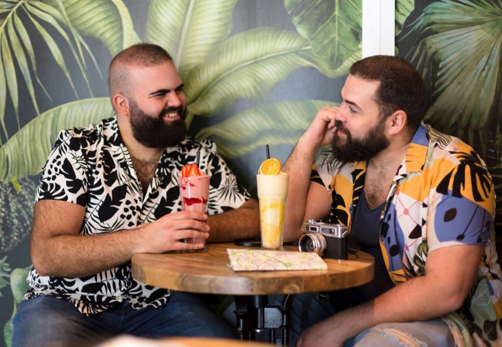 Men chatting and drinking at a bar