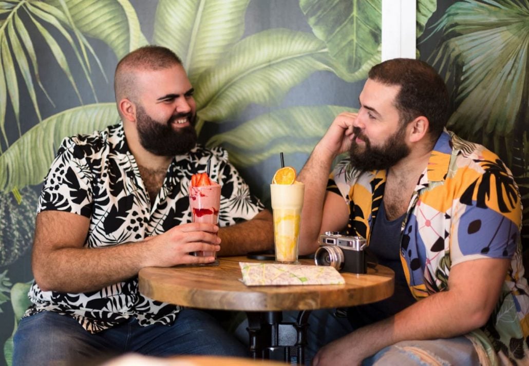 Men chatting and drinking at a bar