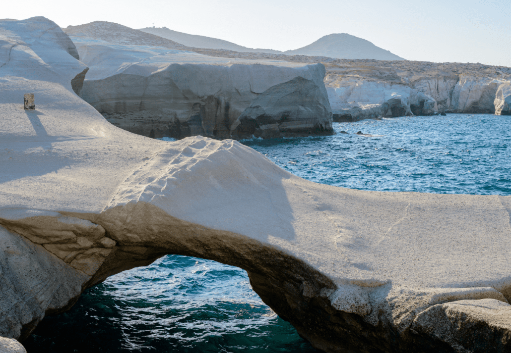 Sarakiniko Beach Greece with ocean and lunar landscape