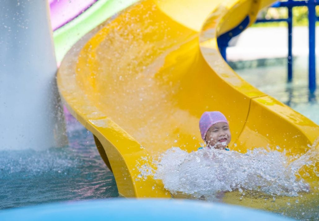 A child going down a water slide