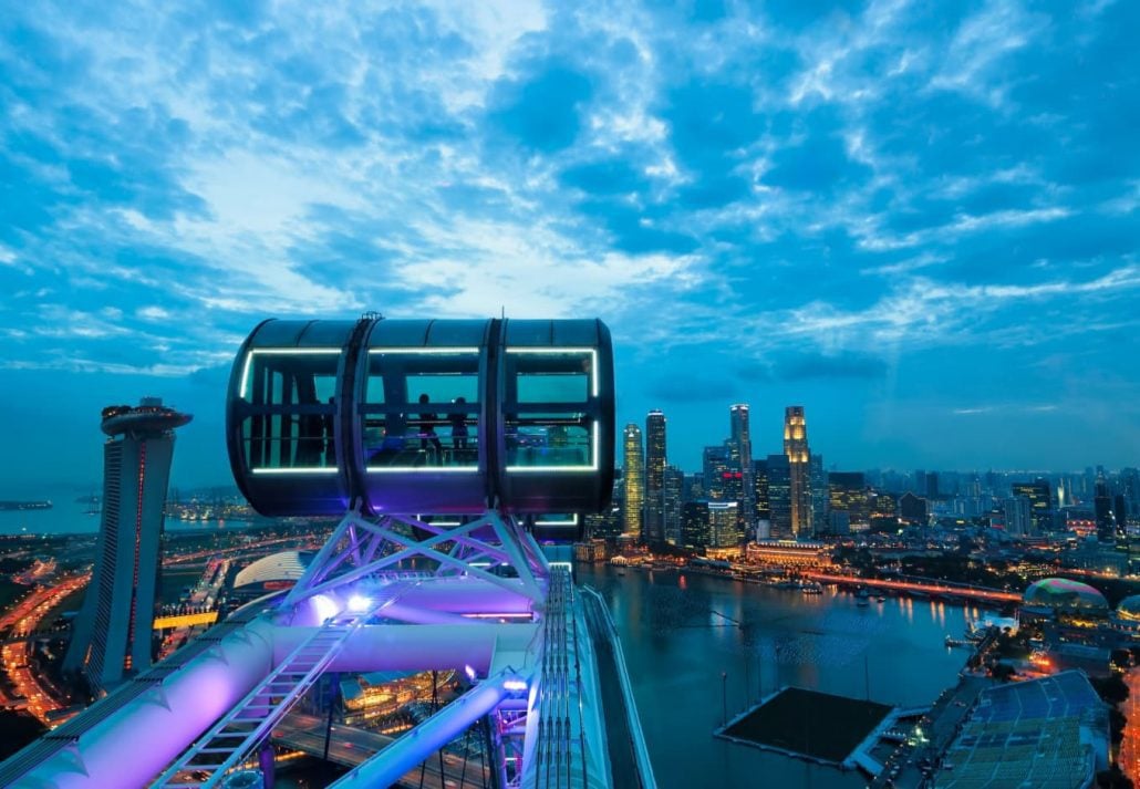 Singapore Flyer overlooking Singapore's skyline.