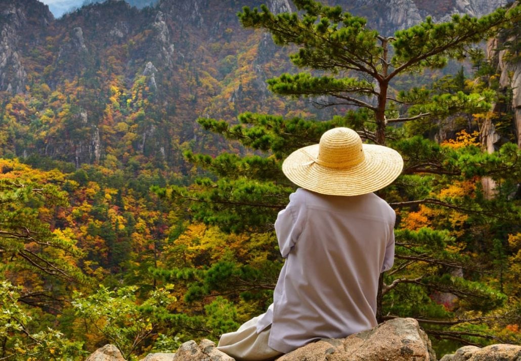 A monk meditating on a rock