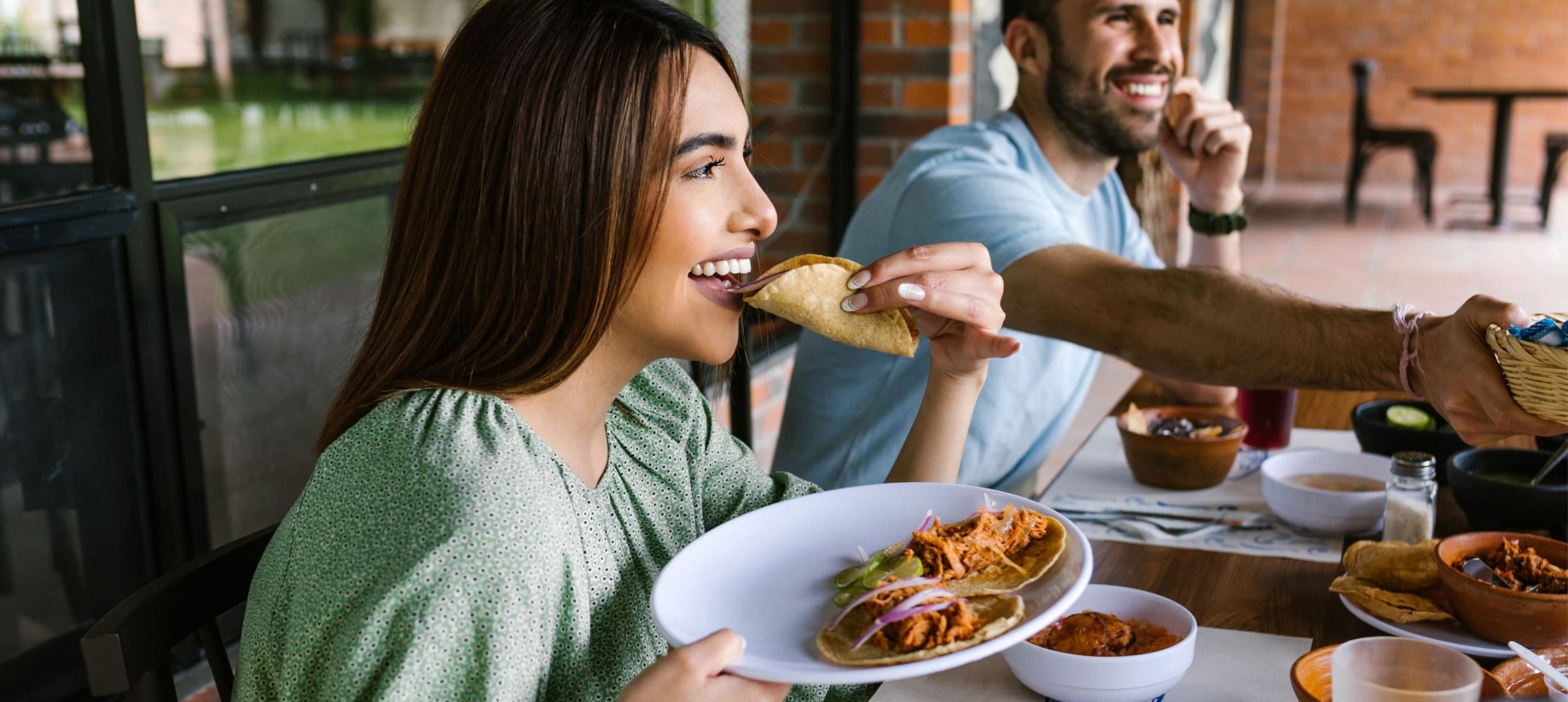 A woman eating at a Mexican restaurant