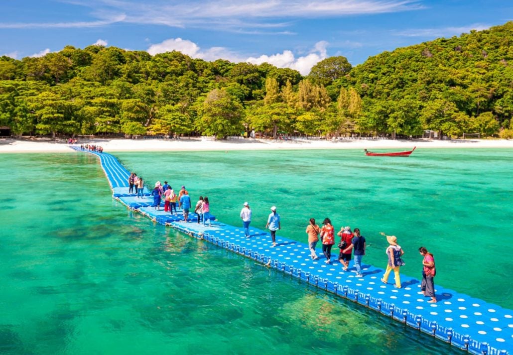 Tourists walking on a bridge to Koh Hae 