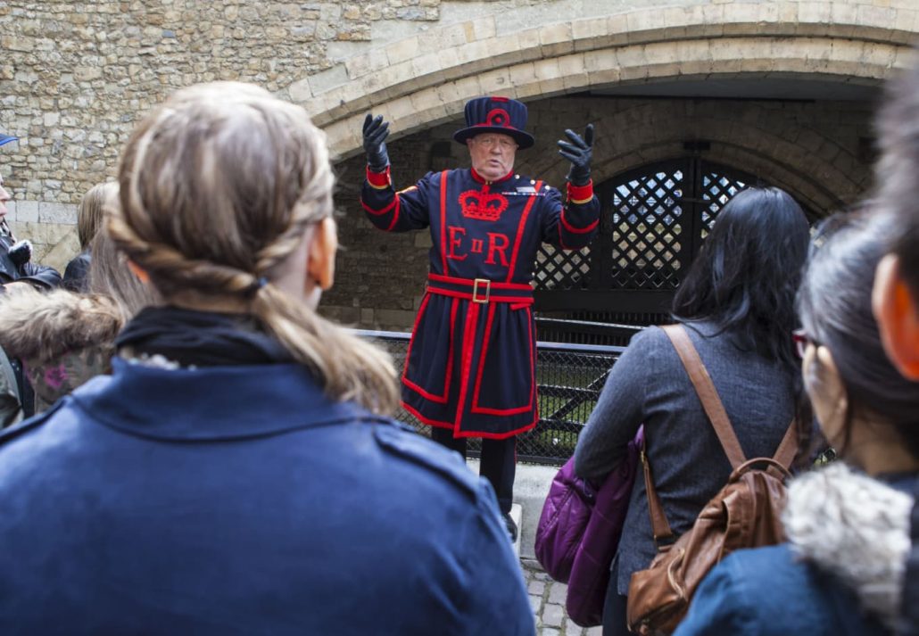 People gathered during a walking tour in London, UK.