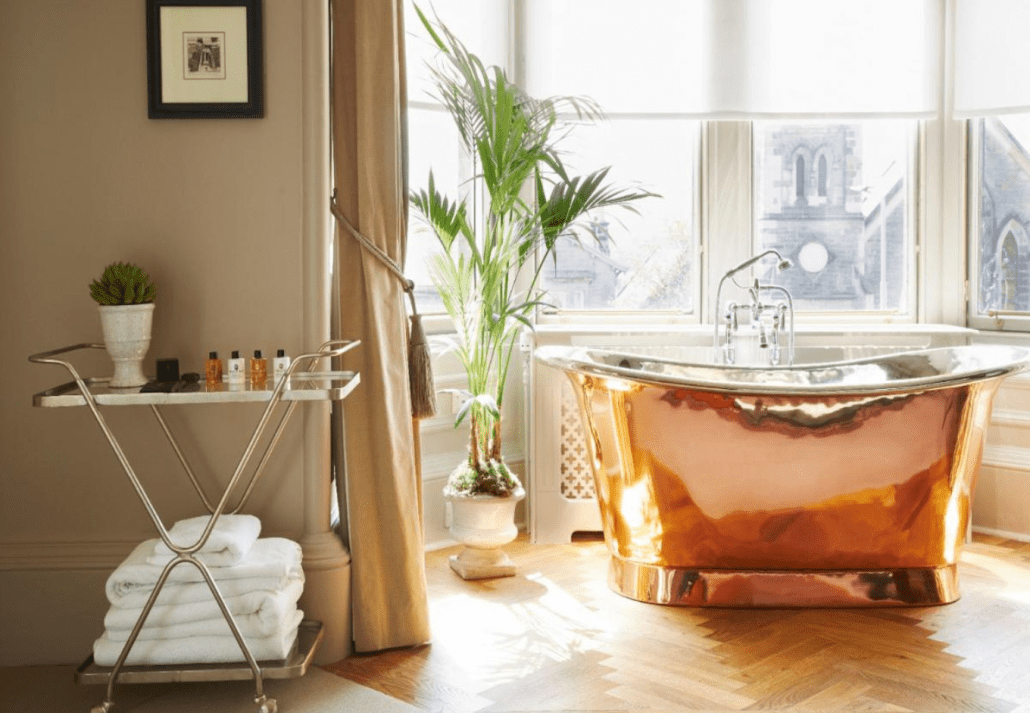 Beautiful bathoom with a copper bathtub at the The Dunstane Houses, Edinburgh, Scotland.