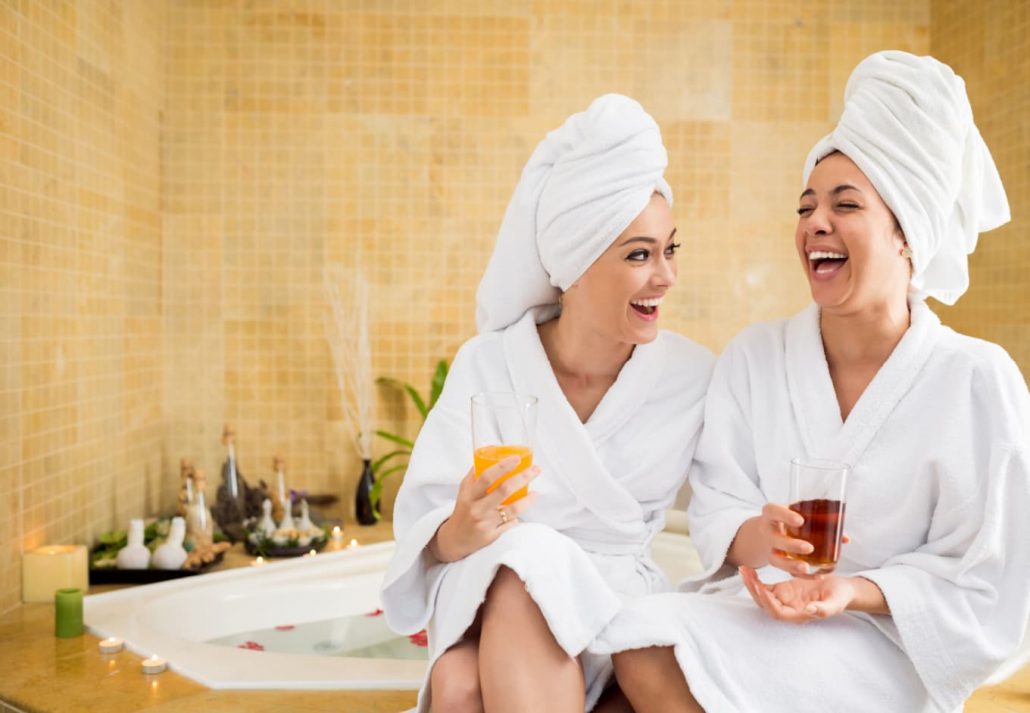 two women talking and laughing at a spa