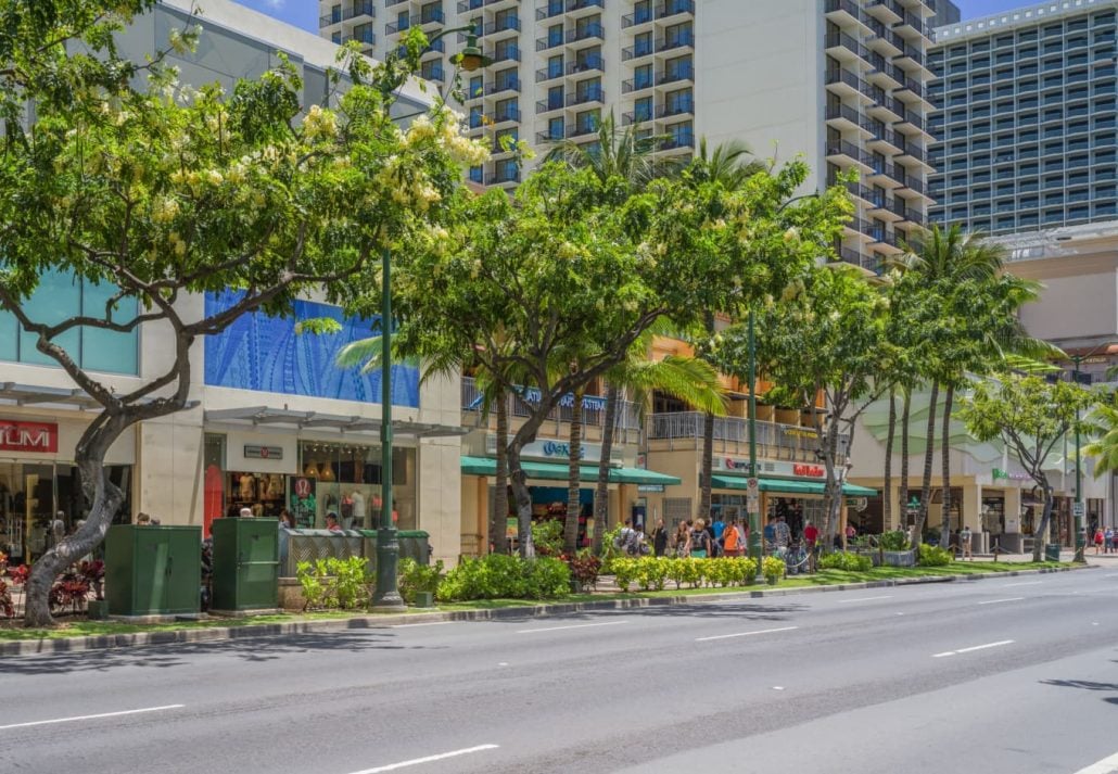 a street with shops in Honolulu