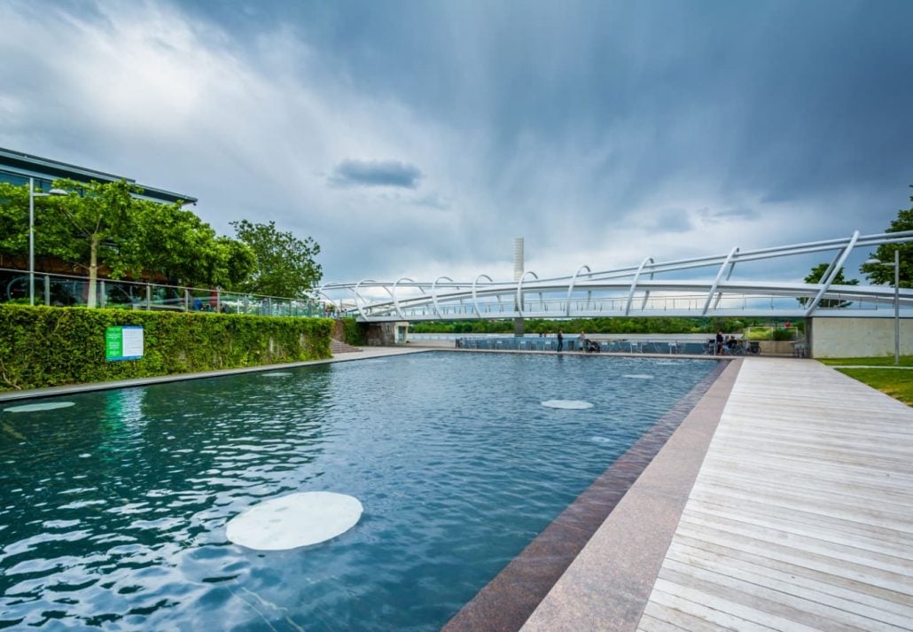 dancing fountain area with a bridge in the distance at Yards Park