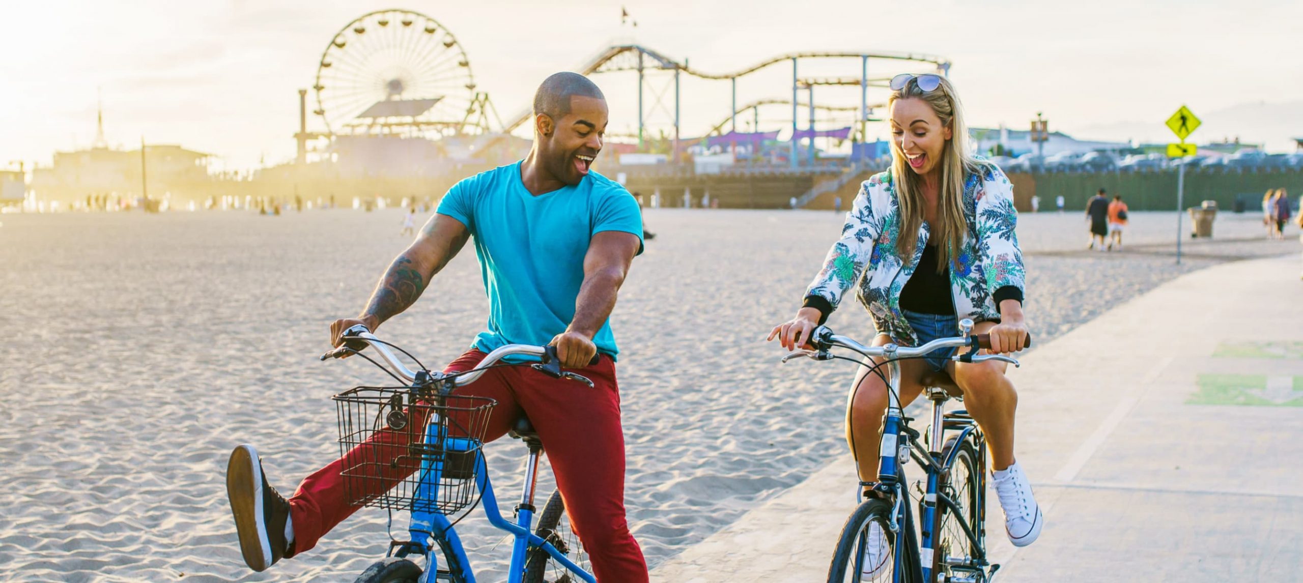 A couple biking in Santa Monica, California.