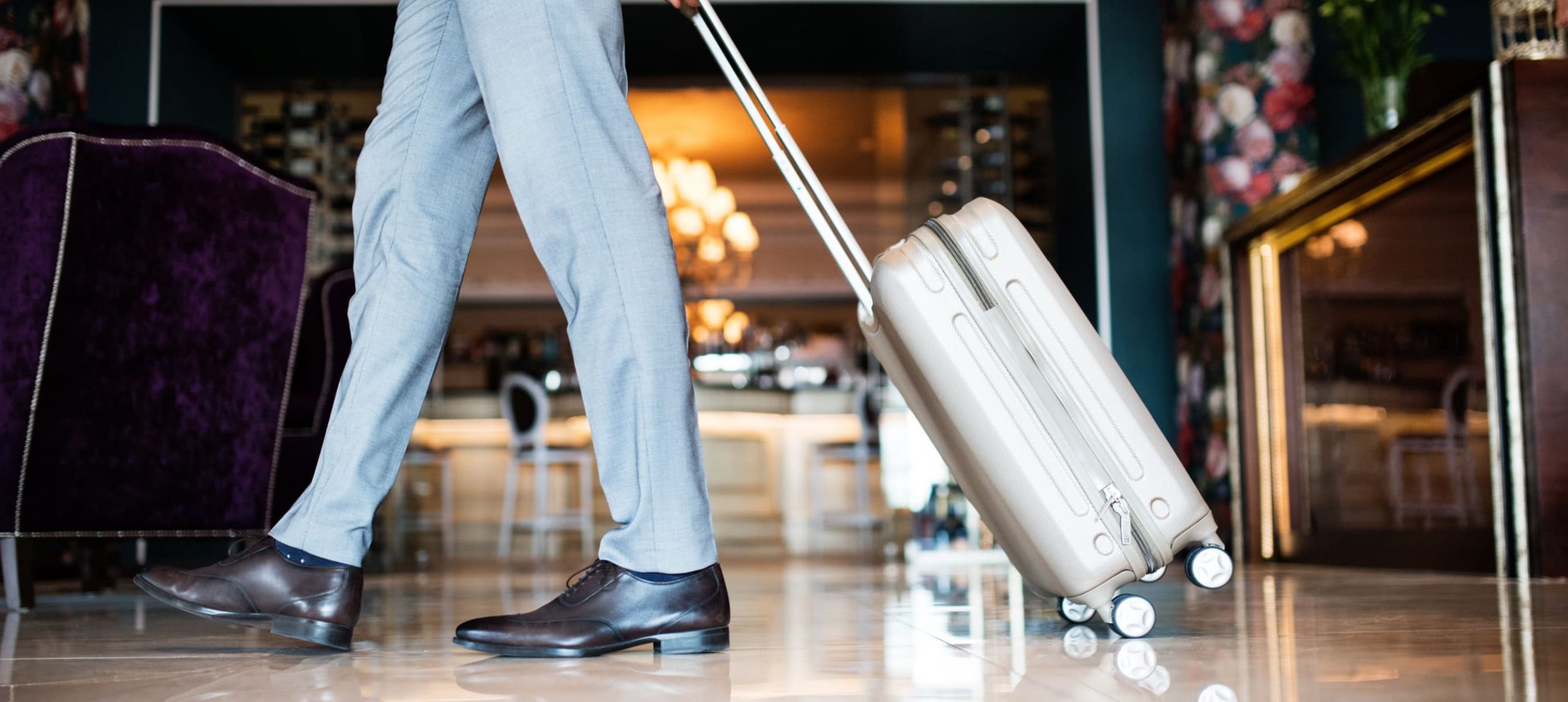 a man walking with a suitcase