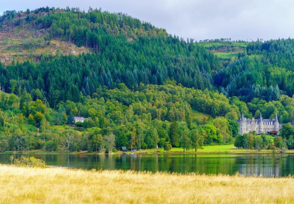 View of the Tigh Mor castle, and Loch Achray, in Loch Lomond and the Trossachs National Park, Scotland, UK.